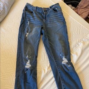 Distressed skinny/straight jeans.